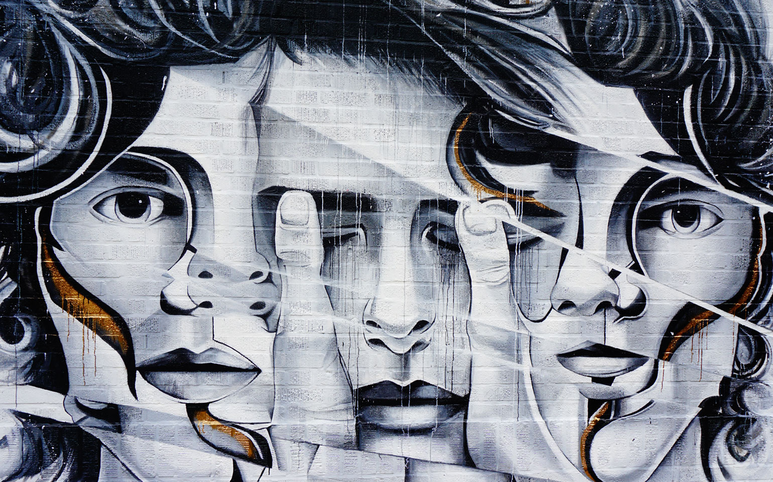 Multiple faces appear on a canvas. Each face shows a different mood.