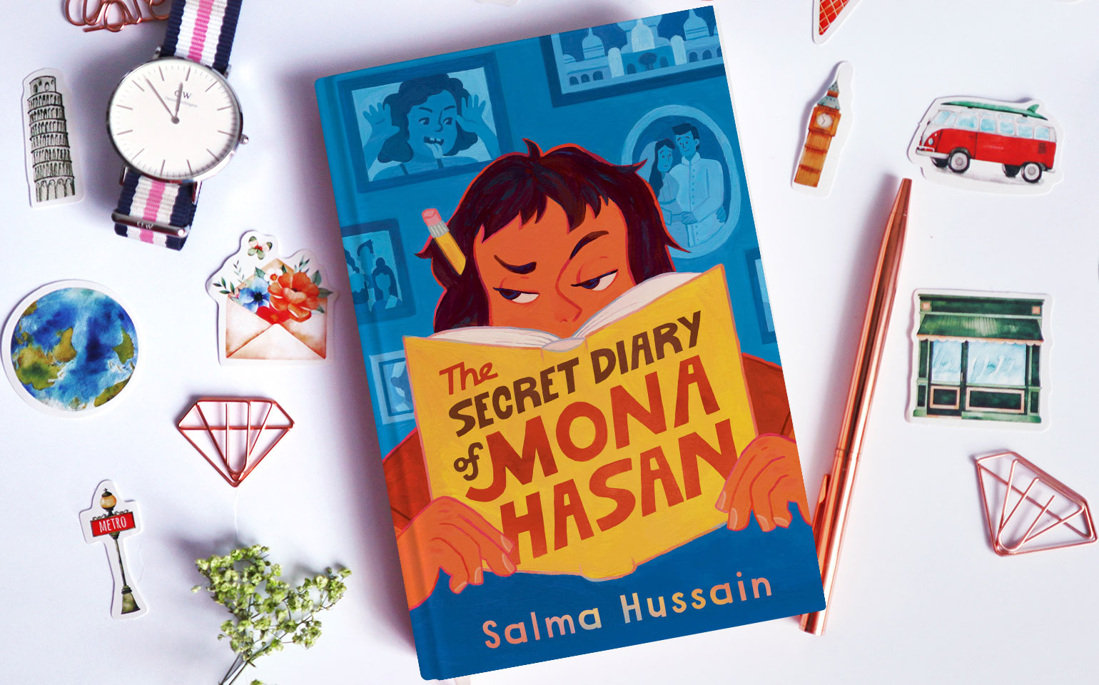 The cover of The Secret Diary of Mona Hasan is shown, which shows Mona peering over the top of a book.