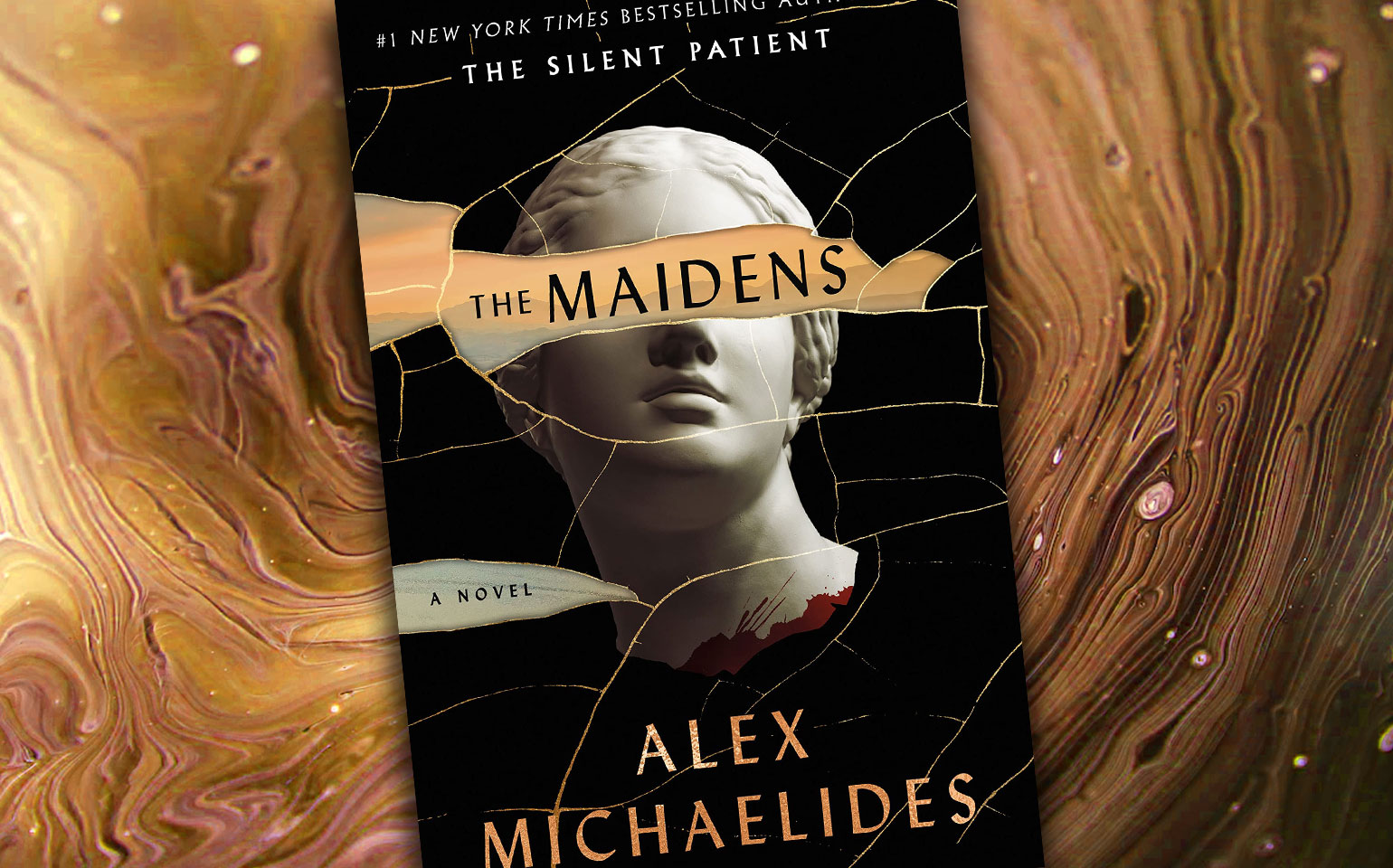 The cover of The Maidens is shown.
