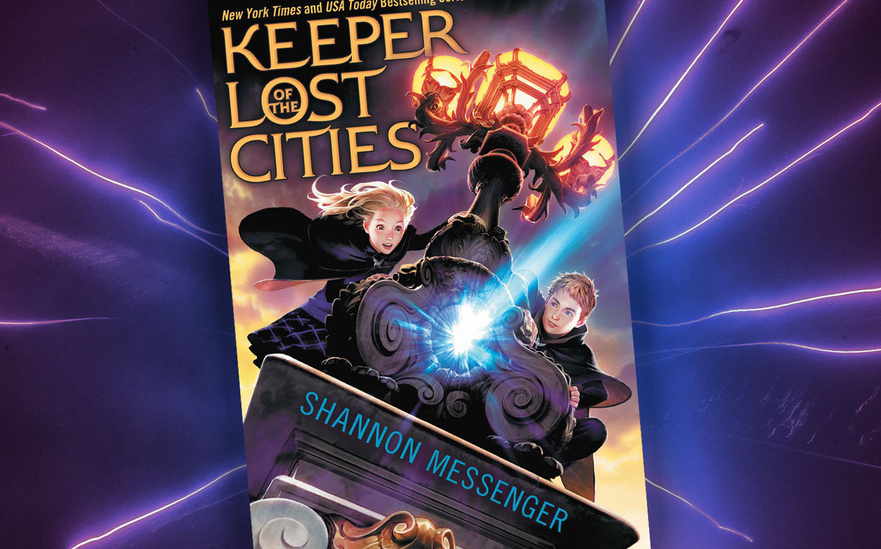 The cover of Keeper of the Lost Cities is shown, showing two characters holding on to the side of a train engine.