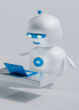 A robot looks at a computer.