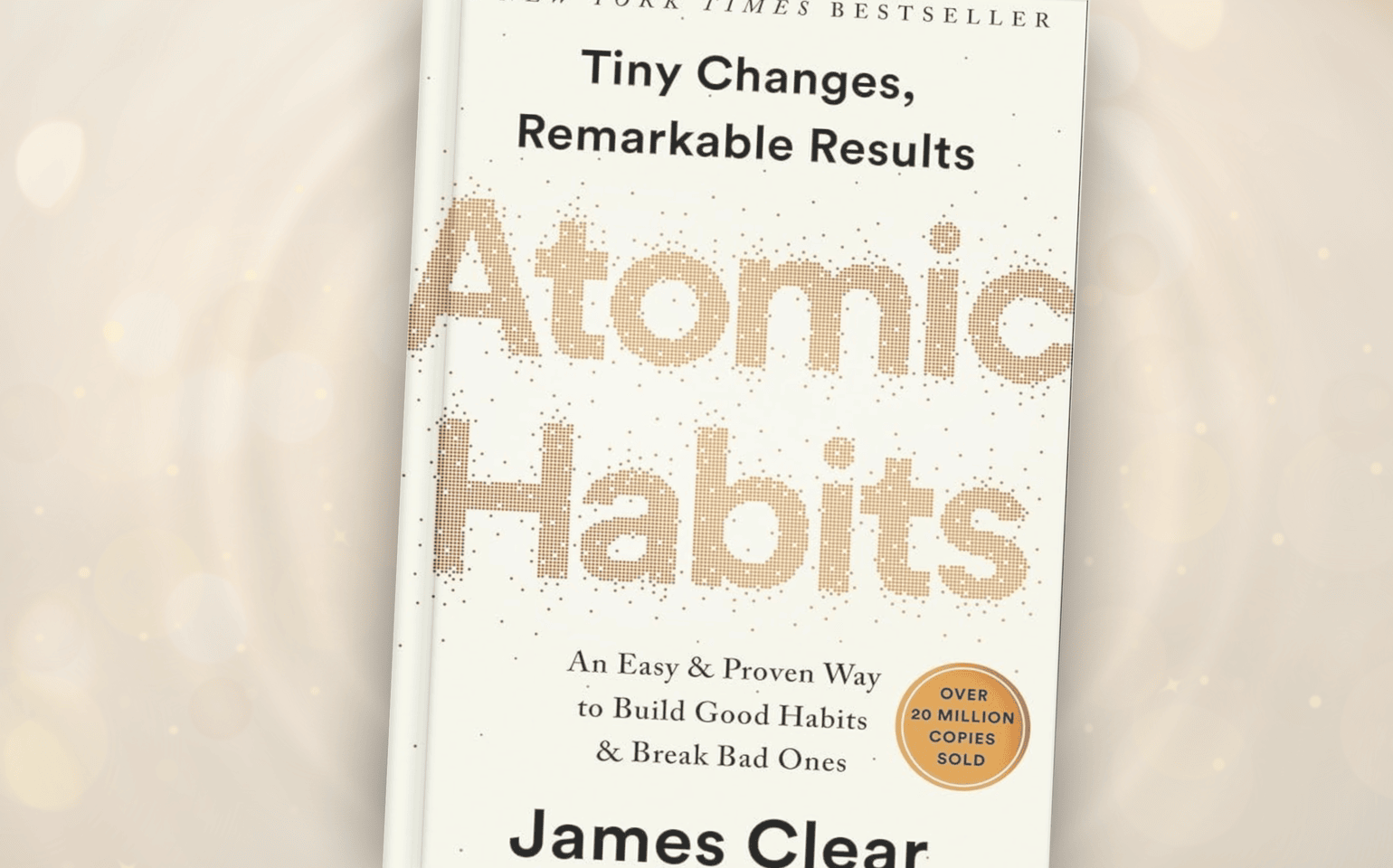 The cover of Atomic Habits by James Clear is shown.